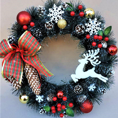 Christmas wreath with decor on the door