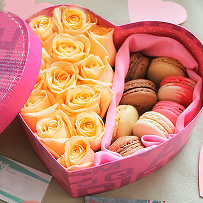 Cream roses in a box with macaroons "Surprise"